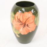 A Moorcroft Coral Hibiscus pattern ovoid vase, height 18cm