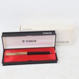 A Parker fountain pen, gold plated and black lacquer case with 14ct gold nib, boxed