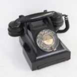 A Vintage black Bakelite dial telephone