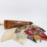An Oriental parasol, and various hand fans