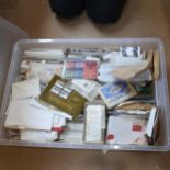 A large boxful of various postage stamps, including sets and Mint