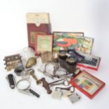 A box of interesting items, including handcuffs, opera glasses, games, Bridge marker etc