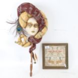 An Atelier Lago ceramic Venetian mask, and a Byzantine tapestry panel from Florence, framed (2)