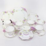 An Art Deco Paragon China Purple Pansy pattern part tea and cake service, comprising 5 x cups, 5 x