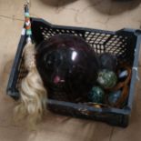 A large amethyst glass ball, a hair switch, paperweights etc