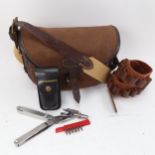A leather satchel, leather cartridge belt, and Leatherman tool