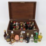 A box containing miniature liqueurs, Whiskys etc