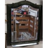 An Antique bevel-edge mirror, with decorative cut borders and velvet-covered frame, with shelf,
