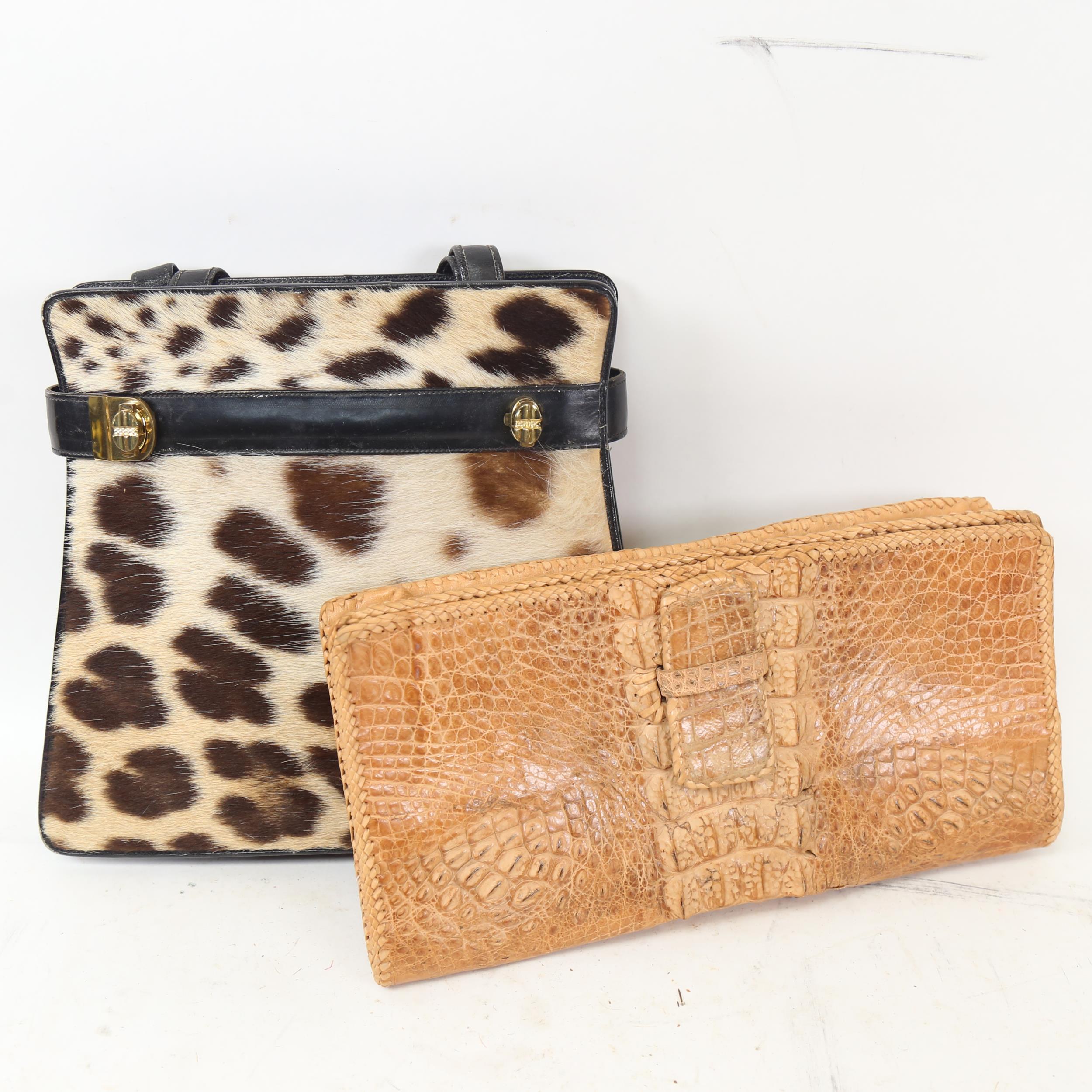 A Vintage crocodile skin clutch bag, width 30cm, and a leopard fur-covered leather handbag and purse