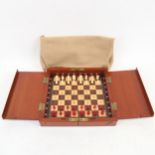 A late 19th/early 20th century Whittington style travelling chess set, stained red and white