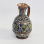 A Doulton Lambeth stoneware ewer, height 21cm Neck has been repaired and overpainted, otherwise no