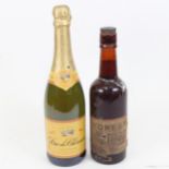 A bottle of Forest Brown Ale, and a bottle of Duc De Cherence Vin Mousseux