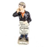 A large ceramic Greenlees Claymore Favourite Scotch advertising figure, modelled as a newspaper boy,
