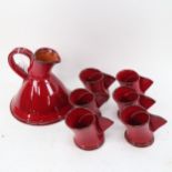 A red glazed terracotta 7-piece set, signed H, jug height 17cm