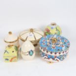 A group of French Longwy items, including a vase with painted dragonfly and butterfly decoration,