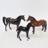 A Beswick black Arab stallion, a Dartmoor pony 1642, and a foal