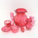 A Victorian cranberry glass Mary Gregory enamelled box, diameter 7cm, matching ring stand, and
