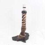 TAXIDERMY - a zebra's leg and hoof table lamp, height 43cm