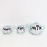 A 1930s 3-piece blue pottery tea set, with chrome covers, height 14cm