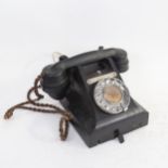 A Vintage black Bakelite dial telephone