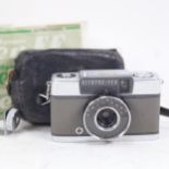 A Vintage Olympus PEN EE camera, in leather case, with box and instructions
