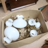 Various brass oil lamps with milk glass shades