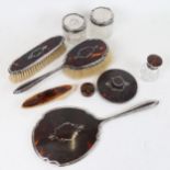 A George V silver and tortoiseshell dressing table set, and a silver-mounted hair tidy and scent