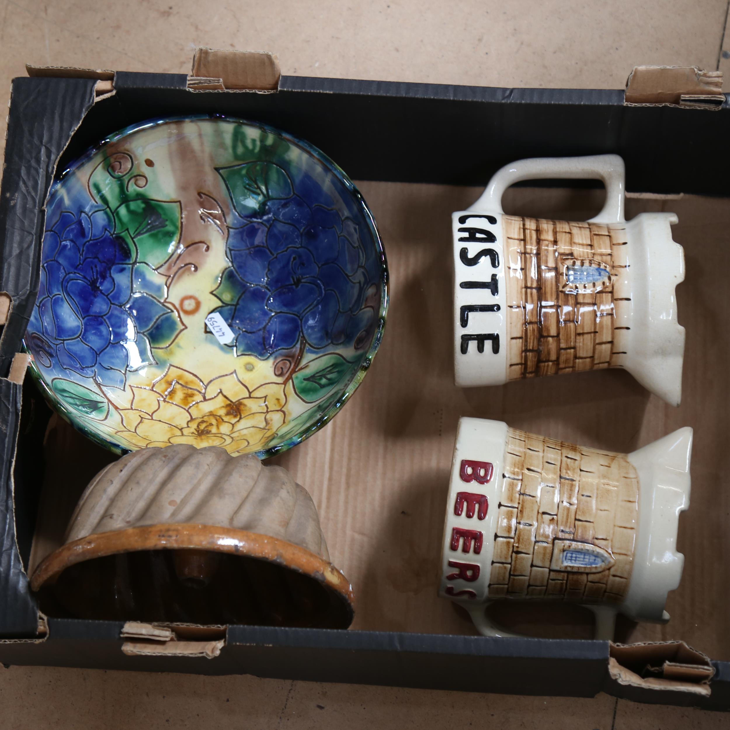 A Victorian clay mould, ale jugs, and an incised and painted pottery bowl