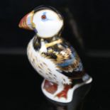 A Royal Crown Derby porcelain puffin figure, with gold button