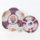 A Chinese porcelain tea bowl, with painted dragon and animals, and 2 Imari plates