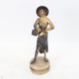 An Art Deco patinated spelter sculpture, dancing lady with tambourine, on polished marble base,