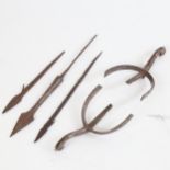 A pair of Antique military spurs, stamped Kerby, 2 Ethnic arrowheads, and an early arrowhead
