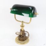 A brass desk lamp with green glass shade, height 57cm