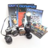 OLYMPUS - a Vintage OM-1 35mm single lens reflex camera, with 2 Olympus lenses and various manuals