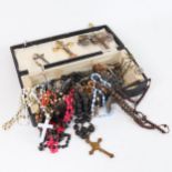 A quantity of roseries, silver cross and chain, religious pendants etc