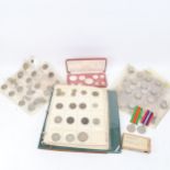 A coin album containing Victorian silver half crowns, and other silver coins, various sleeves of