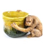 A large Bretby figural pottery jardiniere, modelled as a monkey holding a basket, model no. 1251,
