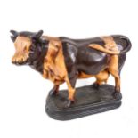 A reproduction painted composition butcher's bull advertising figure, length 50cm, height 35cm No