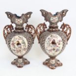 A pair of Majolica pottery 2-handled vases, with relief moulded garden bird design panels, height