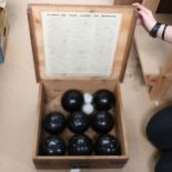 A set of Slazenger's lawn bowls, in original pine box