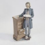 Lladro porcelain figure by a chest of drawers, 34cm