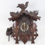 A Black Forest carved wood cuckoo clock, height 39cm