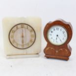 An Art Deco onyx mantel clock, height 19cm, and a small Art Nouveau mahogany mantel clock, both