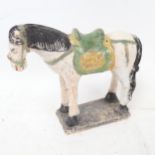 A painted clay figure of a horse on plinth, height 19.5cm