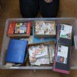 A large boxful of loose postage stamps, postmarks, First Day Covers etc