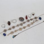 A tray containing Danish silver jewellery, a silver and amber set ring, a target brooch, a silver