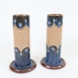 A pair of Art Nouveau Royal Doulton stoneware cylinder vases, model no. 8409, height 20cm