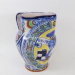 A large Italian polychrome Maiolica pottery wash jug, with QM monogram, signed Minardi, Faenza,
