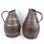 A large graduated pair of coopered oak water flagons, largest height 46cm