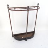 A Victorian cast-iron and brass-framed stick stand, height 60cm, width 50cm